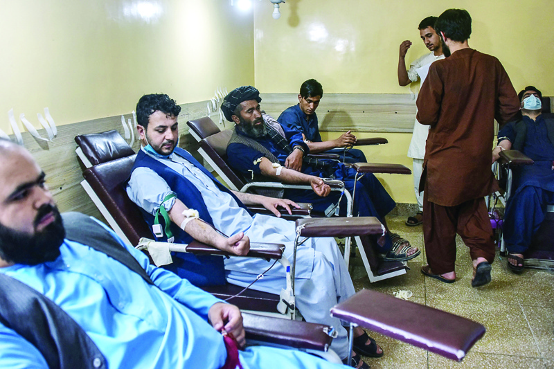 KANDAHAR: Men donate blood for people who got injured during clashes between Taleban and government forces, in Kandahar district on July 12, 2021. - AFPnn