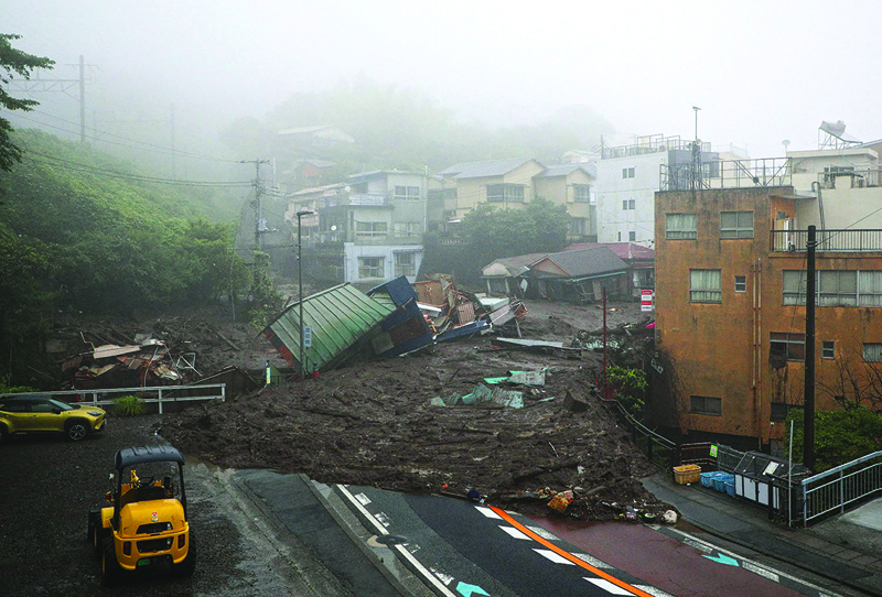 ATAMI: A general view shows mud and debris at the scene of a landslide following days of heavy rain in the Izusan area of Atami in Shizuoka Prefecture yesterday. - AFPnnn