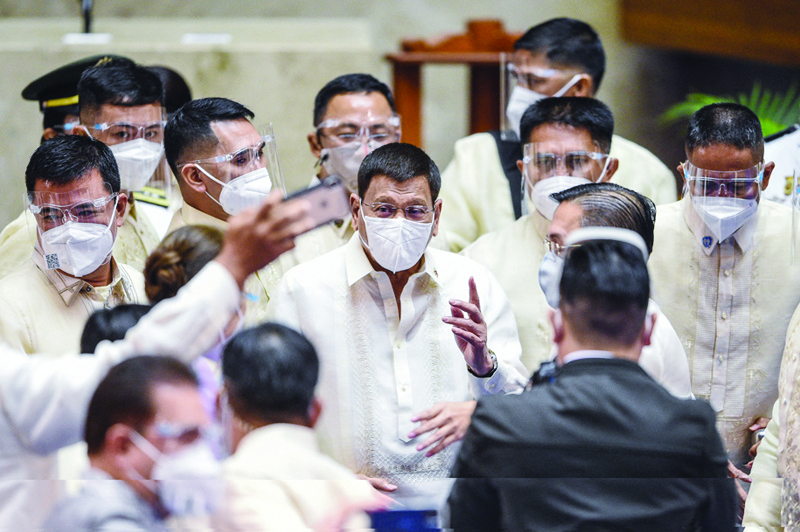 MANILA: Philippine President Rodrigo Duterte leaves after the annual state of the nation address at the House of Representatives in Manila yesterday. - AFPn