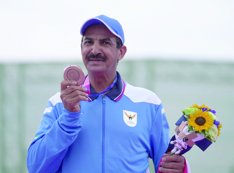 Kuwait's Abdullah Al-Rashidi poses with his bronze medal.