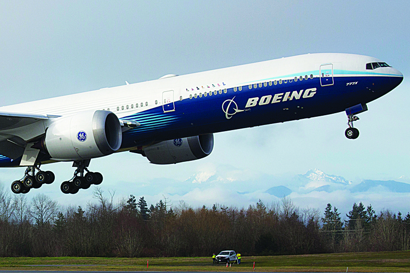 EVERETT, US: In this file photo a Boeing 777X airplane takes off on its inaugural flight at Paine Field in Everett, Washington. - AFPn