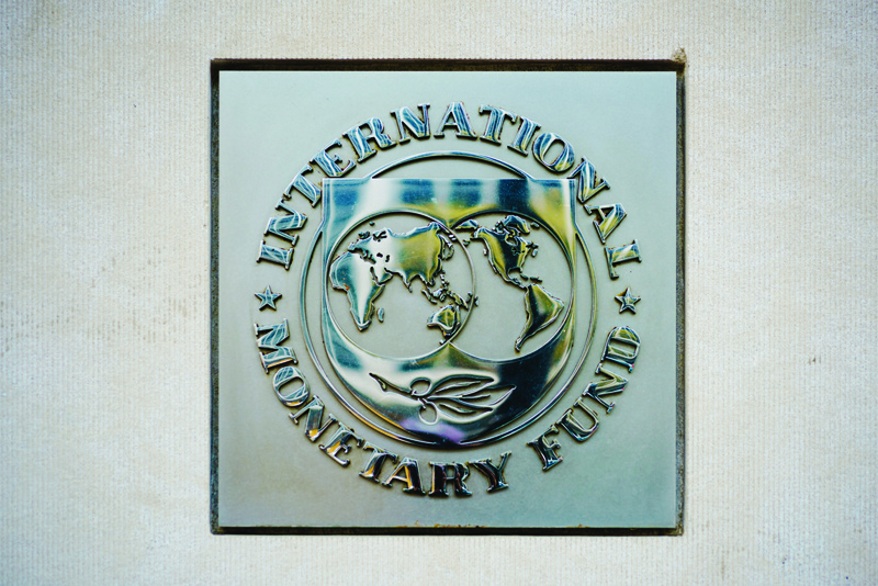 WASHINGTON: In this file photo the seal of the International Monetary Fund (IMF) is seen outside of a headquarters building in Washington. - AFPn