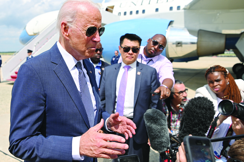 ANDREWS AIR FORCE BASE, US: US President Joe Biden speaks to the press as he makes his way to board Air Force One before departing from Andrews Air Force Base in Maryland Friday. - AFPn