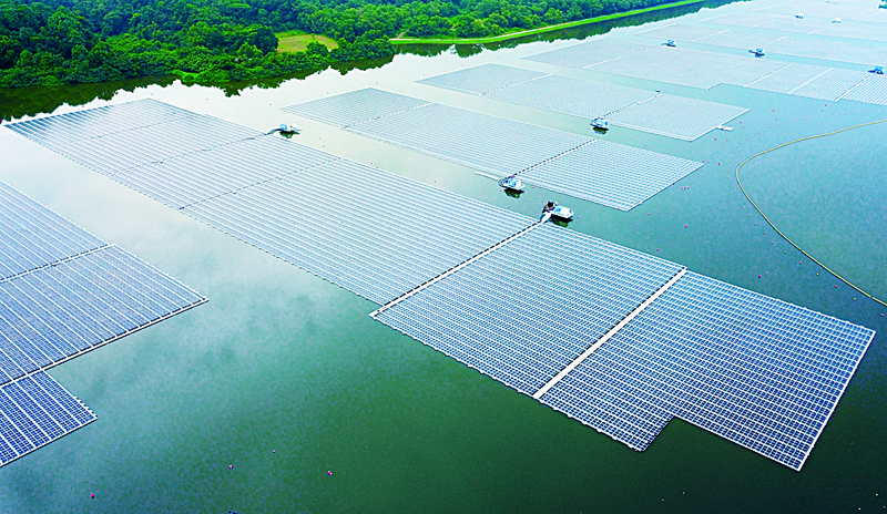 SINGAPORE: This undated handout photograph released by Singapore's national water agency PUB yesterday shows an aerial view of Sembcorb energy company's new floating solar power farm at Tengeh reservoir in Singapore. – AFPnn