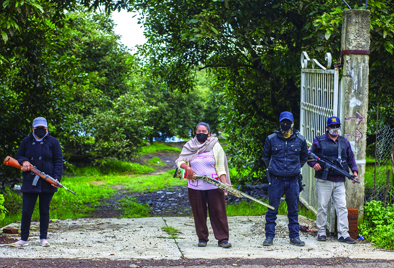 ARIO DE ROSALES, Mexico: Members of the self-defense group Pueblos Unidos carry out guard duties in protection of avocado plantations, whipped by drug cartels that dominate the area, in Ario de Rosales, state of Michoacan, Mexico.-AFPnnn