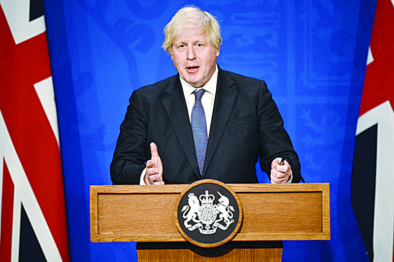 LONDON: File photo shows Britain's Prime Minister Boris Johnson gives an update on relaxing restrictions imposed on the country during the coronavirus COVID-19 pandemic at a virtual press conference inside the Downing Street Briefing Room. - AFPn