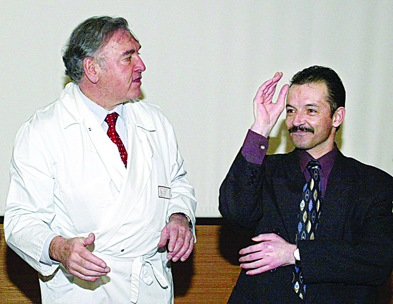LYON: File photo shows, Professor Jean-Michel Dubernard (L), who had directed the world's first two-hand transplant on Denis Chatelier (R), take part in a press conference, on January 24, 2003 at the Edouard Herriot Hospital in Lyon. - AFPnnn