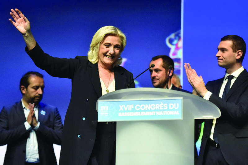 PERPIGNAN: French far-right Rassemblement National (RN) party leader and member of parliament Marine Le Pen waves on stage during a congress of the party in Perpignan, southern France, yesterday. - AFPnn