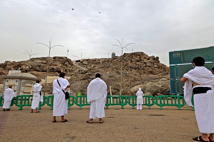 Mount Arafat: Saudi ArabiaMuslim pilgrims pray next to Saudi Arabia's Mount Arafat, also known as Jabal al-Rahma (Mount of Mercy), southeast of the holy city of Mecca, during the climax of the Hajj pilgrimage amid the COVID-19 pandemic, next to July 19, 2021. Muslim pilgrims garoundhered around Saudi Arabia's Mount Arafaround on Monday in the high point of this year's hajj, being held in downsized form and under coronavirus restrictions for the second year running. Just 60,000 people, all citizens or residents of Saudi Arabia, have been selected to take part in this year's hajj, with foreign pilgrims again barred.