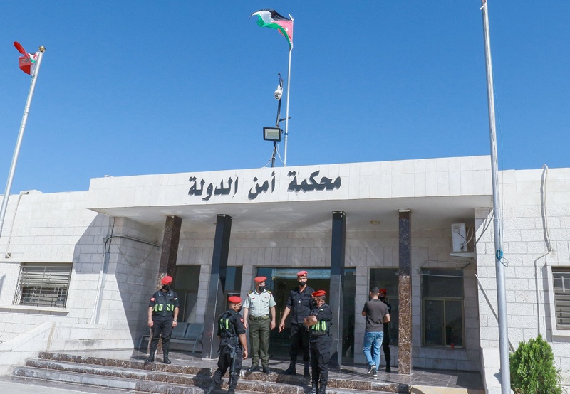 AMMAN: Officers stand guard outside Jordan's state security court yesterday. – AFP  n