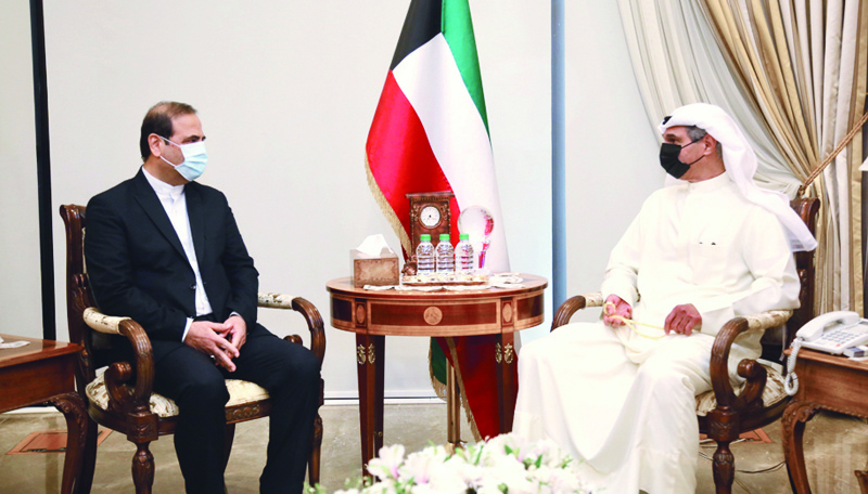 KUWAIT: Deputy Minister of Foreign Affairs Majdi Al-Dhafiri meets Iranian Ambassador to Kuwait Mohammad Irani. - KUNA photosn