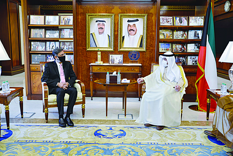 KUWAIT: Minister of Foreign Affairs Sheikh Dr Ahmad Nasser Al-Mohammad Al-Sabah meets the newly appointed World Health Organization's Representative in Kuwait Dr Assad Hafeez. - KUNAn