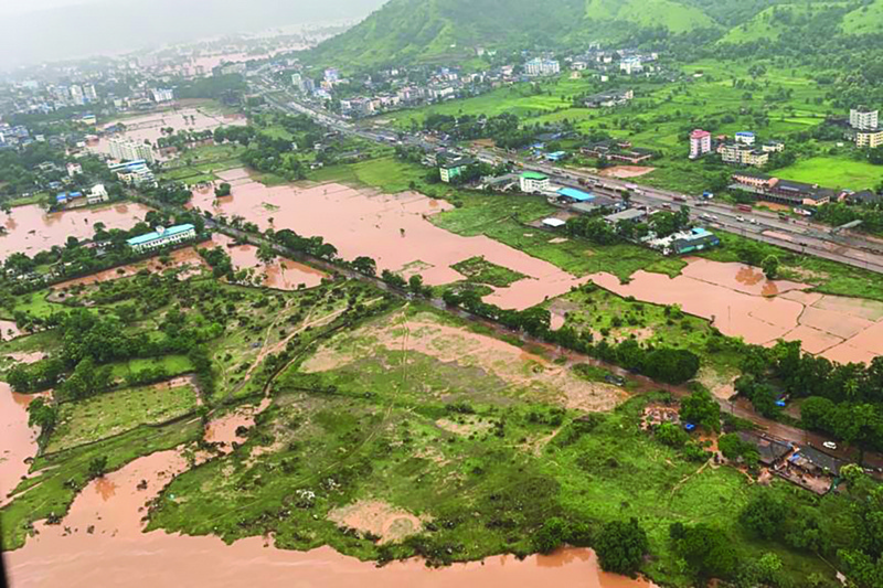 MAHARASHTRA: This handout photo taken on Friday by the Indian Navy shows areas inundated with flood water after heavy monsoon rains in Raigad district of Maharashtra. - AFPn