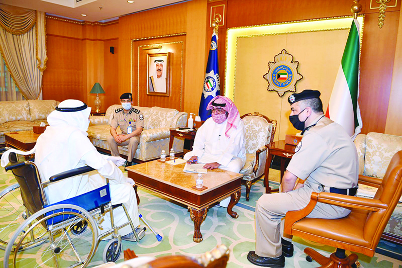 KUWAIT: Kuwait's Interior Minister Sheikh Thamer Ali Al-Sabah meets a citizen in his office at the Interior Ministry yesterday. - KUNAn