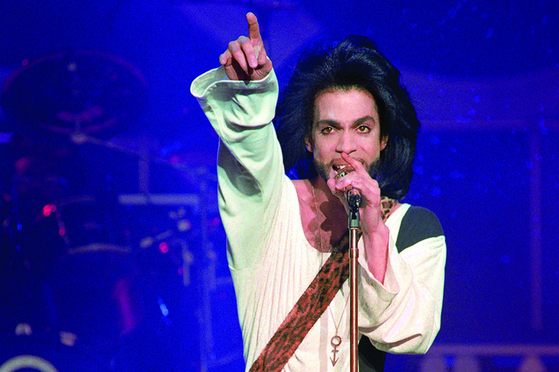 In this file photo taken on June 16, 1990, musician Prince performs on stage during his concert at the Parc des Princes stadium in Paris. – AFP n