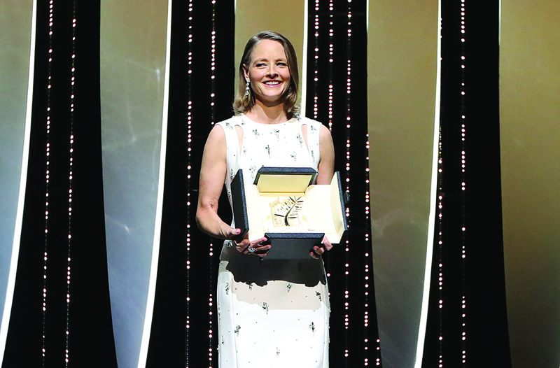 US actress and director Jodie Foster poses on stage after she received a Palme d'Or Life Achievement Award during the opening ceremony of the 74th edition of the Cannes Film Festival in Cannes, southern France. — AFP n