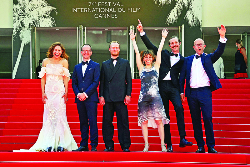 (From left) Finnish actress Seidi Haarla, Finnish director Juho Kuosmanen, Russian actor Yuriy Borisov, Russian actress Dinara Drukarova, Finnish actor Tomi Alatalo and finish producer Jussi Rantamaki pose as they arrive for the screening of the film “Hytti No6” (Compartment No6) at the 74th edition of the Cannes Film Festival in Cannes, southern France. — AFP n