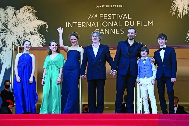 (From left) French actress Juliette Benveniste, French actress Anne-Sophie Bowen-Chatet, Luxembourg actress Vicky Krieps, French actor and director Mathieu Amalric, actor Arieh Worthhalter, actor Sacha Ardilly and actor Aurele Grzesik arrive for the screening of the film “Serre-moi Fort” (Hold Me Tight) at the 74th edition of the Cannes Film Festival in Cannes, southern France. — AFP n