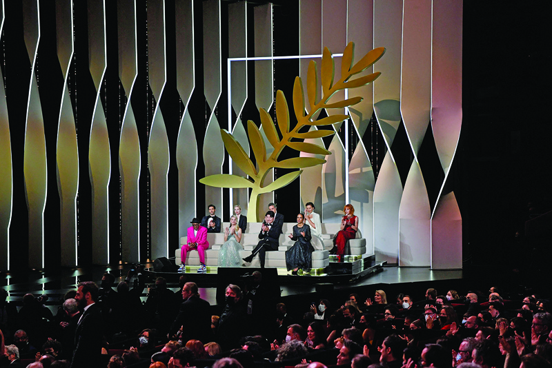 (From front left) US director and Jury President of the 74th Cannes Film Festival Spike Lee, and Jury members French actress and director Melanie Laurent, South Korean actor Song Kang-Ho and French-Senegalese director Mati Diop, (back, from left) French actor Tahar Rahim, Austrian director Jessica Hausner, Brazilian director Kleber Mendonca Filho, US actress Maggie Gyllenhaal and French-Canadian singer Mylene Farmer attend the opening ceremony of the 74th edition of the Cannes Film Festival in Cannes, southern France.—AFP n