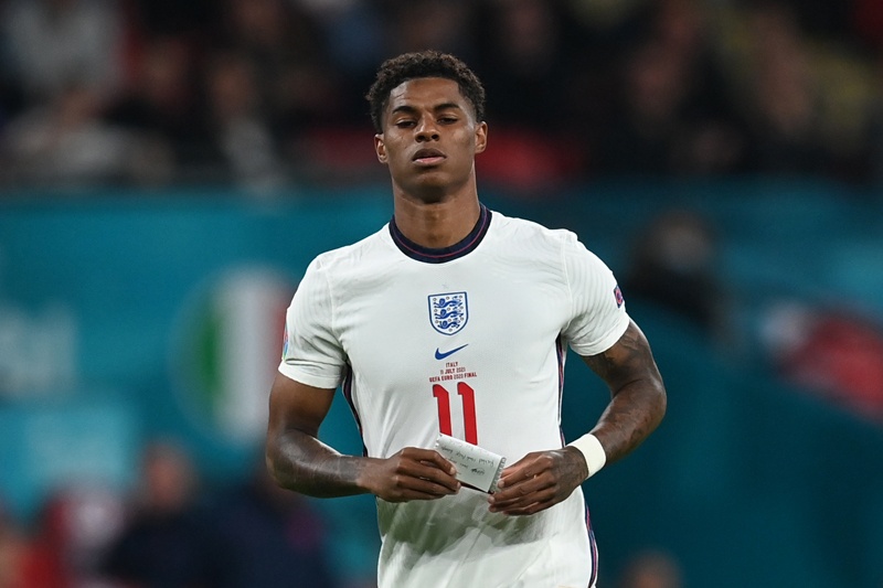 LONDON: England's forward Marcus Rashford carries a note during the Euro 2020 final football match between Italy and England at the Wembley Stadium in London on Sunday. – AFPn
