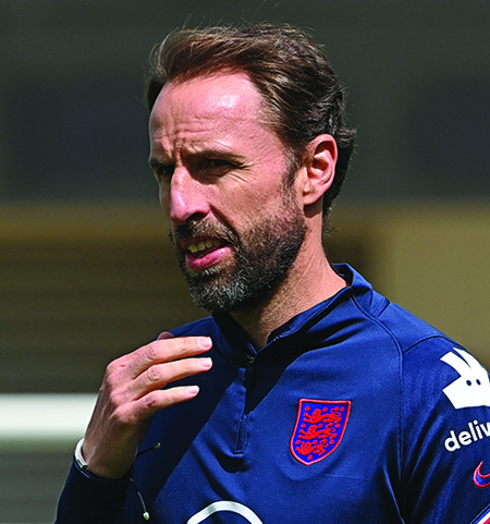 BURTON-ON-TRENT: England's coach Gareth Southgate attends an England training session at St George's Park in Burton-on-Trent, central England, yesterday. – AFPn