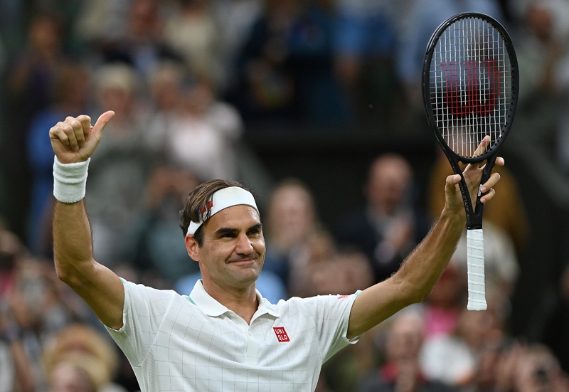 LONDON: Switzerland's Roger Federer celebrates winning against Italy's Lorenzo Sonego during their men's singles fourth round match on the seventh day of the 2021 Wimbledon Championships at The All England Tennis Club in Wimbledon, southwest London, on Monday. – AFPn
