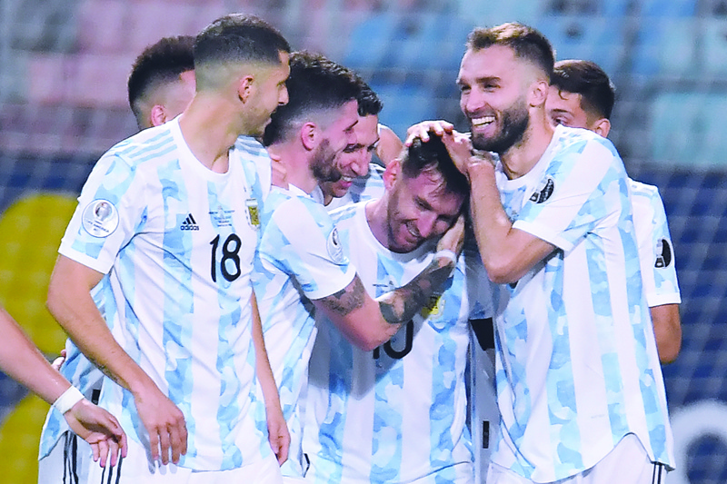 GOIANIA: Argentina's Lionel Messi (center) celebrates with teammates after scoring against Ecuador during their Conmebol 2021 Copa America football tournament quarter-final match at the Olympic Stadium in Goiania, Brazil, on Saturday. - AFPnn