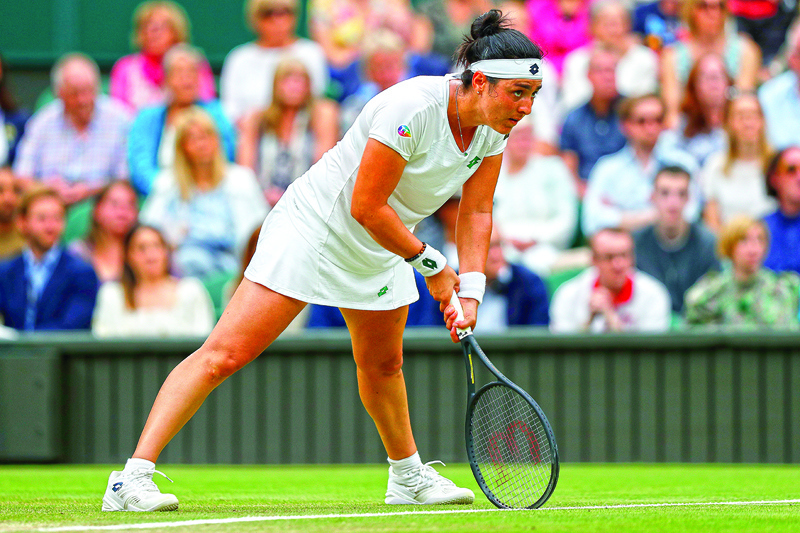LONDON: Tunisia's Ons Jabeur reacts against Belarus's Aryna Sabalenka during their women's quarter-final tennis match on the eighth day of the 2021 Wimbledon Championships at The All England Tennis Club in Wimbledon, southwest London, on Tuesday. – AFPn
