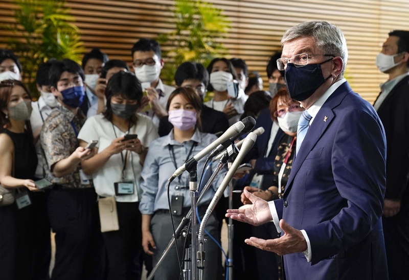 TOKYO: International Olympic Committee President Thomas Bach speaks to the media after meeting Japanese Prime Minister Yoshihide Suga at the prime minister's official residence in Tokyo yesterday. - AFPn