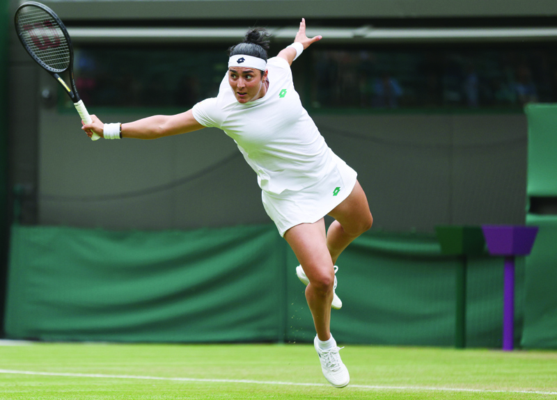 LONDON: Tunisia's Ons Jabeur returns against US player Venus Williams during their women's singles second round match on the third day of the 2021 Wimbledon Championships at The All England Tennis Club in Wimbledon, southwest London, on Wednesday. - AFPnn