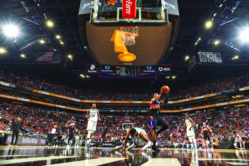 PHOENIX: Chris Paul of the Phoenix Suns drives to the basket during Game One of the 2021 NBA Finals on Tuesday at Phoenix Suns Arena in Phoenix, Arizona. – AFPn