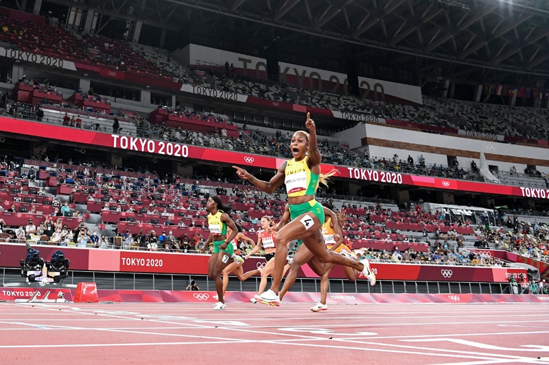 TOKYO: Jamaica's Elaine Thompson-Herah crosses the finish line to win the women's 100m final during the Tokyo 2020 Olympic Games at the Olympic Stadium in Tokyo yesterday. – AFPn