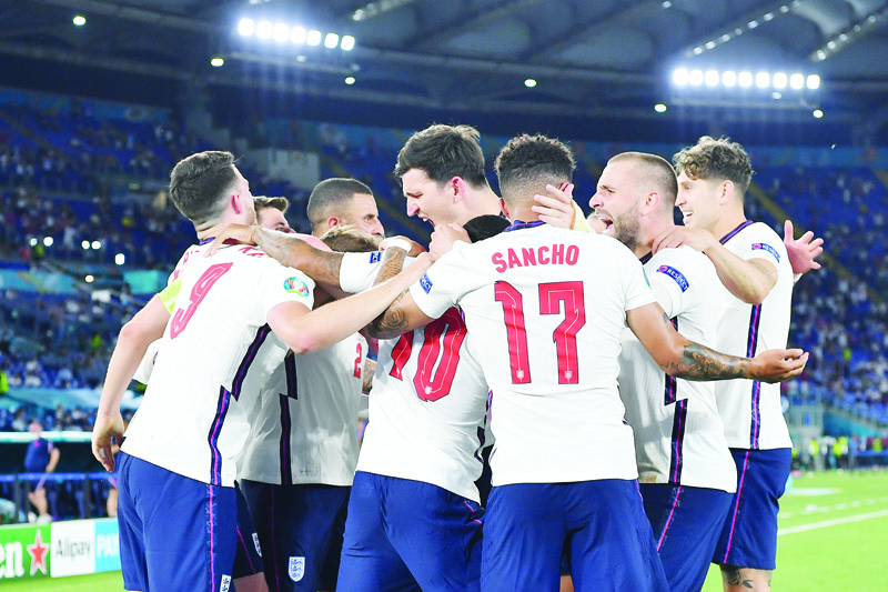 LONDON: England's players celebrate their third goal during the Euro 2020 quarter-final football match between Ukraine and England at the Olympic Stadium in Rome on Saturday. - AFPn