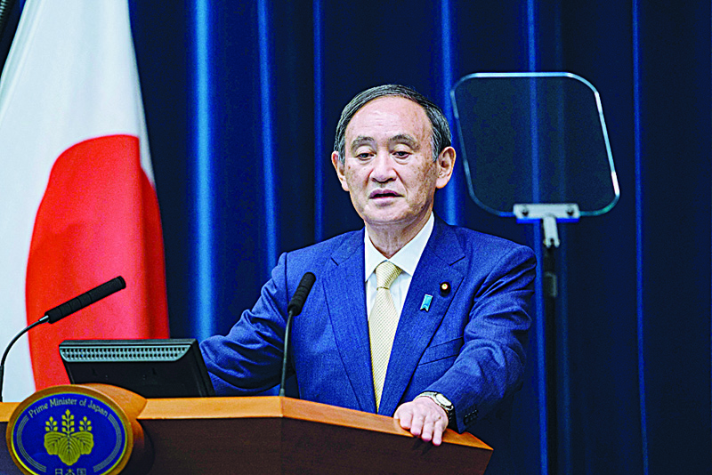 TOKYO: Japan's Prime Minister Yoshihide Suga speaks during a press conference on a new COVID-19 coronavirus state of emergency stretching throughout the Tokyo Olympics, at the prime minister's official residence yesterday. - AFP n