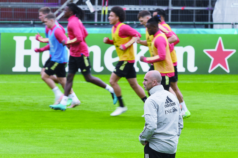 TUBIZE: Belgium's Spanish coach Roberto Martinez oversees a training session at the team's base camp at the Belgian National Football Center in Tubize on Wednesday. - AFPnn