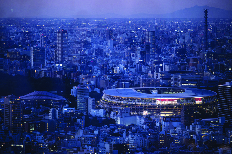 TOKYO: This picture shows the National Stadium, the main venue for the Tokyo 2020 Olympic and Paralympic Games, lit up at dusk in Tokyo on Friday. - AFPn