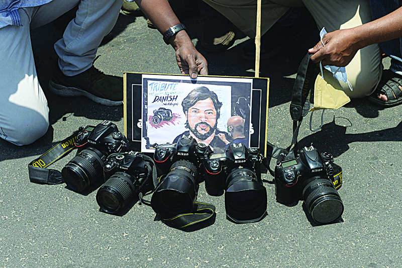 HYDERABAD: Telangana State Photo Journalist Association (TSPJA) members pay tribute to Reuters journalist Danish Siddiqui, in Hyderabad yesterday a day after the Pulitzer Prize-winning photographer with the Reuters news agency was killed covering fighting between Afghan security forces and the Taliban. - AFPn
