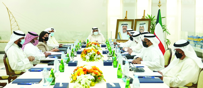 KUWAIT: His Highness the Prime Minister Sheikh Sabah Al-Khaled Al-Sabah chairs a Cabinet meeting yesterday. (Right) HH the Premier speaks with officials during a tour of the proposed investment sites along the Jaber Causeway yesterday. --KUNAnn