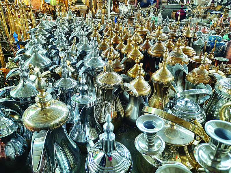 KUWAIT: Dallahs (traditional coffee pots) are displayed for sale at the Friday Market. -- Photo by Shakir Reshamwalann