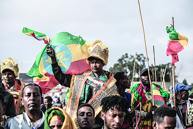 ADDIS ABABA: A protester waves the Ethiopian flag during a rally against pro-TPLF forces and to support Ethiopia's armed forces on Aug 8, 2021. - AFP n