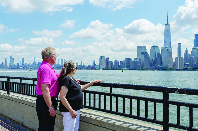 JERSEY CITY: Diane and Kurt Horning, who lost their son Matthew Horning in the September 11, 2001, attacks, look at the New York skyline from the Empty Sky Memorial in Jersey City, New Jersey. -AFPn