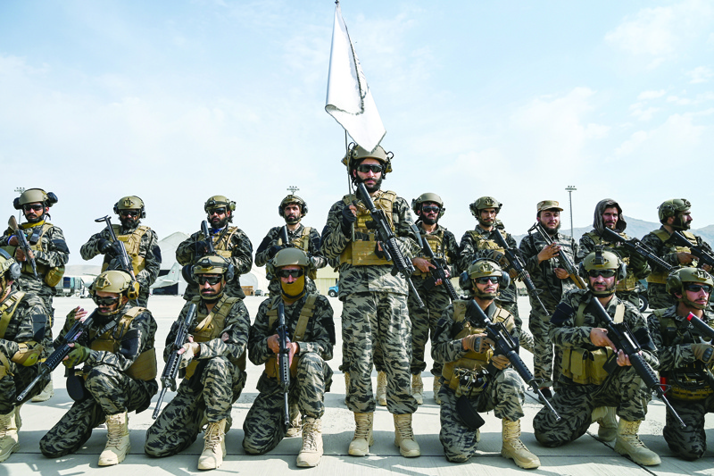 KABUL: Members of the Taleban Badri 313 military unit take a position at the airport in Kabul yesterday after the US has pulled all its troops out of the country to end a brutal 20-year war.-AFPn