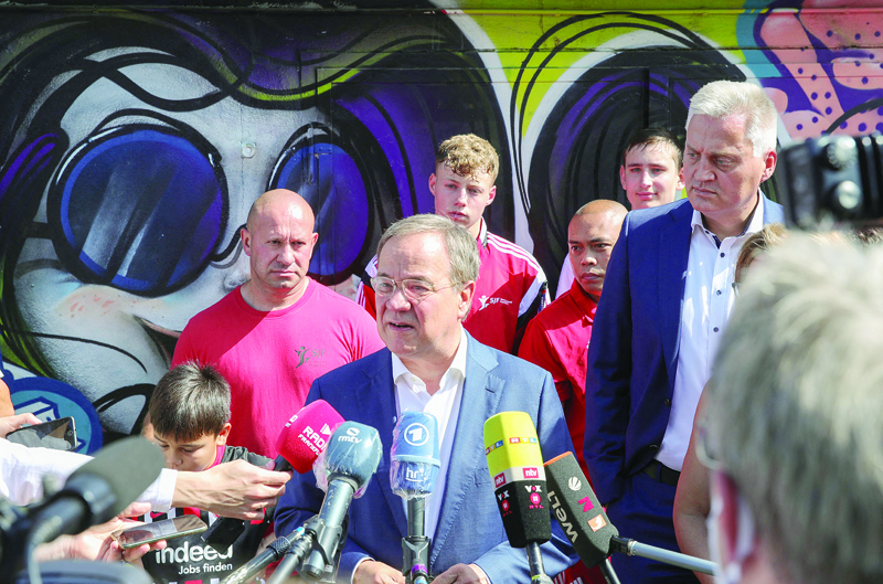 FRANKFURT: Christian Democratic Union leader and candidate for Chancellor Armin Laschet addresses the media after visiting a children and youth boxing camp as part of his electoral campaign yesterday. - AFP n