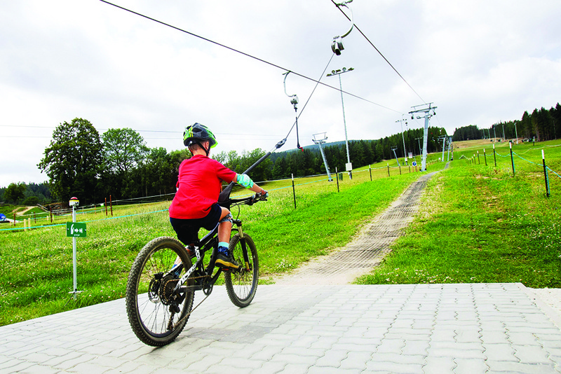 Mountain bikers use the bike lift in the Wexl Trails area in St Corona am Wechsel, Lower Austria.—AFP photosn