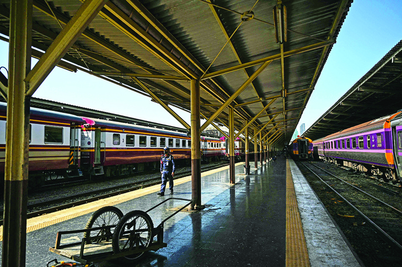 BANGKOK: This photo taken on June 22, 2021 shows a security guard patrolling the platforms at Bangkok Railway Station, more commonly known as Hua Lamphong, in Bangkok. - AFP photosn