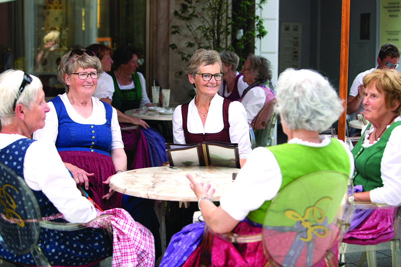 Guests wearing dirndl dresses sit at the Zauner coffee house in Bad Ischl, Upper Austria. — AFP photosn