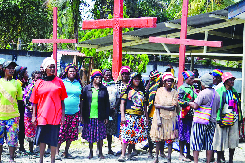 TIMIKA, Indonesia: This file photo taken on August 10, 2021 shows a group of women gathering to protest against the COVID-19 coronavirus vaccine offered by the Indonesian government in Timika, Papua. - AFPn