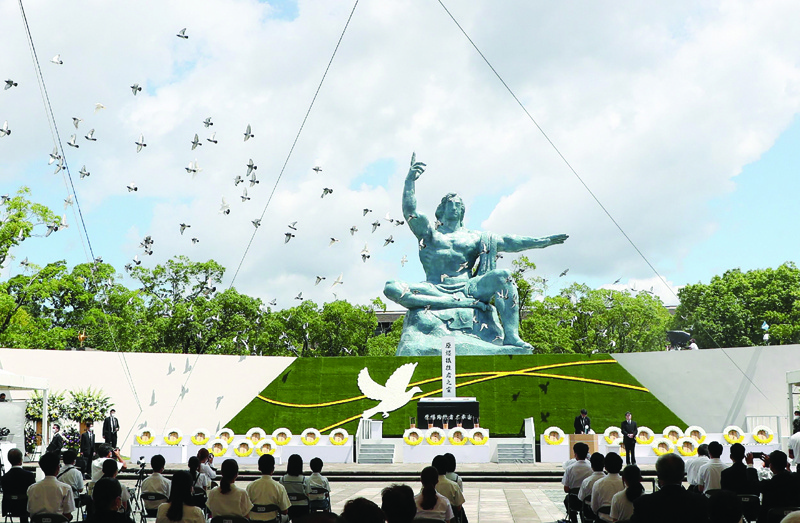 NAGASAKI: Doves fly during a memorial service for victims of the US atomic bombing at the Nagasaki Peace Park yesterday, as the city marks the 76th anniversary of the bombing. - AFP n