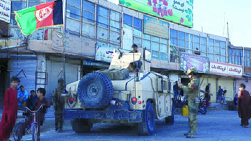 HERAT: This video screen grab from AFPTV shows Afghan special forces patrol the streets of Herat as the Taleban continue a series of offensives against urban areas in Afghanistan Tuesday.-AFPn