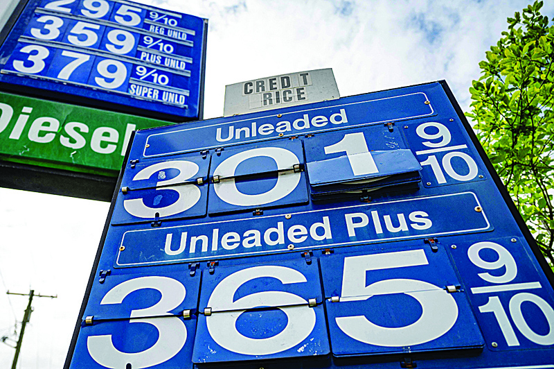 ANNAPOLIS, MARYLAND: File photo shows, gas prices are posted at a station in Annapolis, Maryland. A key US inflation gauge continued to climb last month and income shot higher as the economy bounces back from last year's downturn, according to government data released yesterday. - AFPn